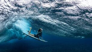 <p>Australian surfer Olivia Ottaway dives under a wave in Teahupo'o, French Polynesia. Teahupo'o will host the surfing event for the Paris Games. Pic: Ryan Pierse, Getty Images</p>