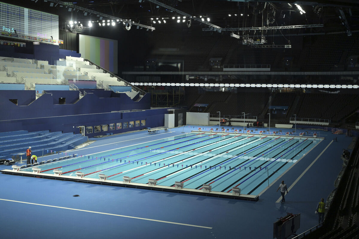 The swimming pool for Olympic competitions in the Paris La Defense Arena in Nanterre, outside Paris. The aquatic centre boasts a wooden frame, photovoltaic panels on the roof, and seating made from recycled local materials. Photo: Bertrand Guay via AP The swimming pool for Olympic competitions in the Paris La Defense Arena in Nanterre, outside Paris. The aquatic centre boasts a wooden frame, photovoltaic panels on the roof, and seating made from recycled local materials. Photo: Bertrand Guay via AP
