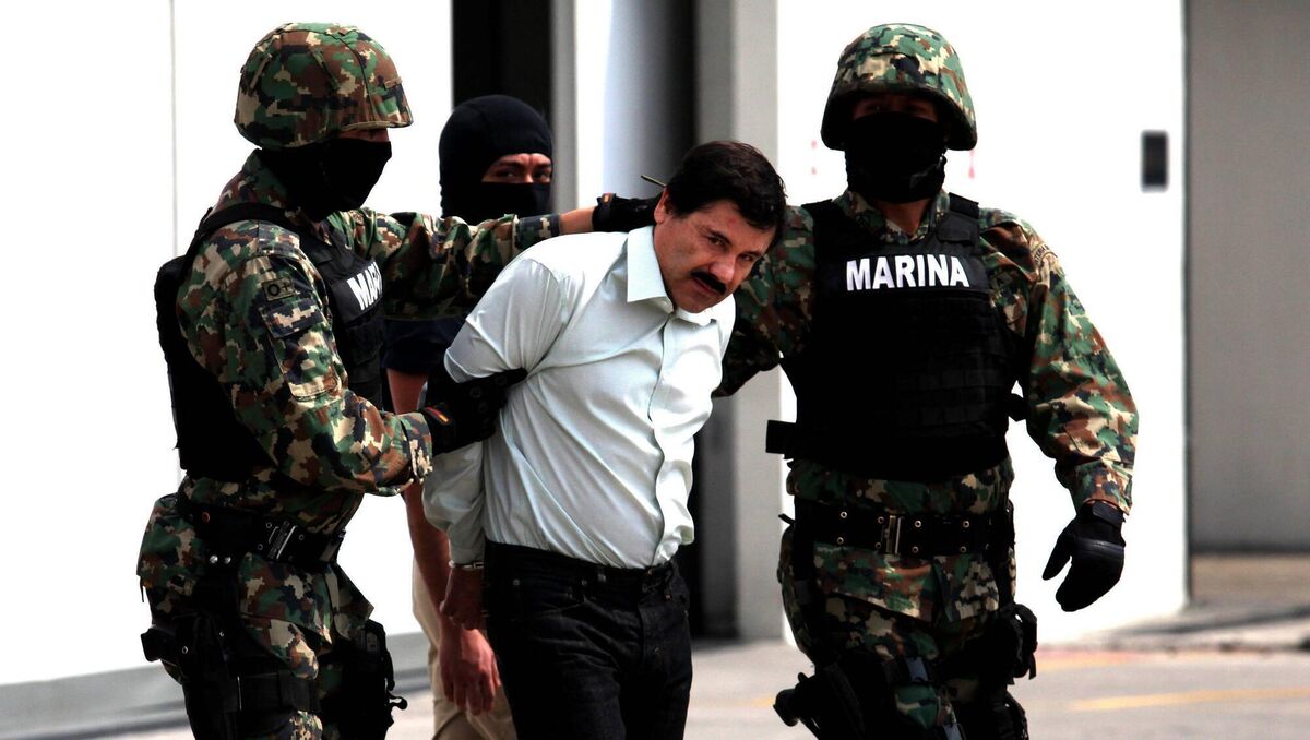 Mexican Navy soldiers escort Joaquin Guzman Loera (front), alias "El Chapo Guzman", leader of the Sinaloa Cartel, during his show up in front of the press, at the Mexican Navy hangar in Mexico City, capital of Mexico, on Feb. 22, 2014. Picture: NurPhoto/Corbis via Getty Images Mexican Navy soldiers escort Joaquin Guzman Loera (front), alias "El Chapo Guzman", leader of the Sinaloa Cartel, during his show up in front of the press, at the Mexican Navy hangar in Mexico City, capital of Mexico, on Feb. 22, 2014. Picture: NurPhoto/Corbis via Getty Images