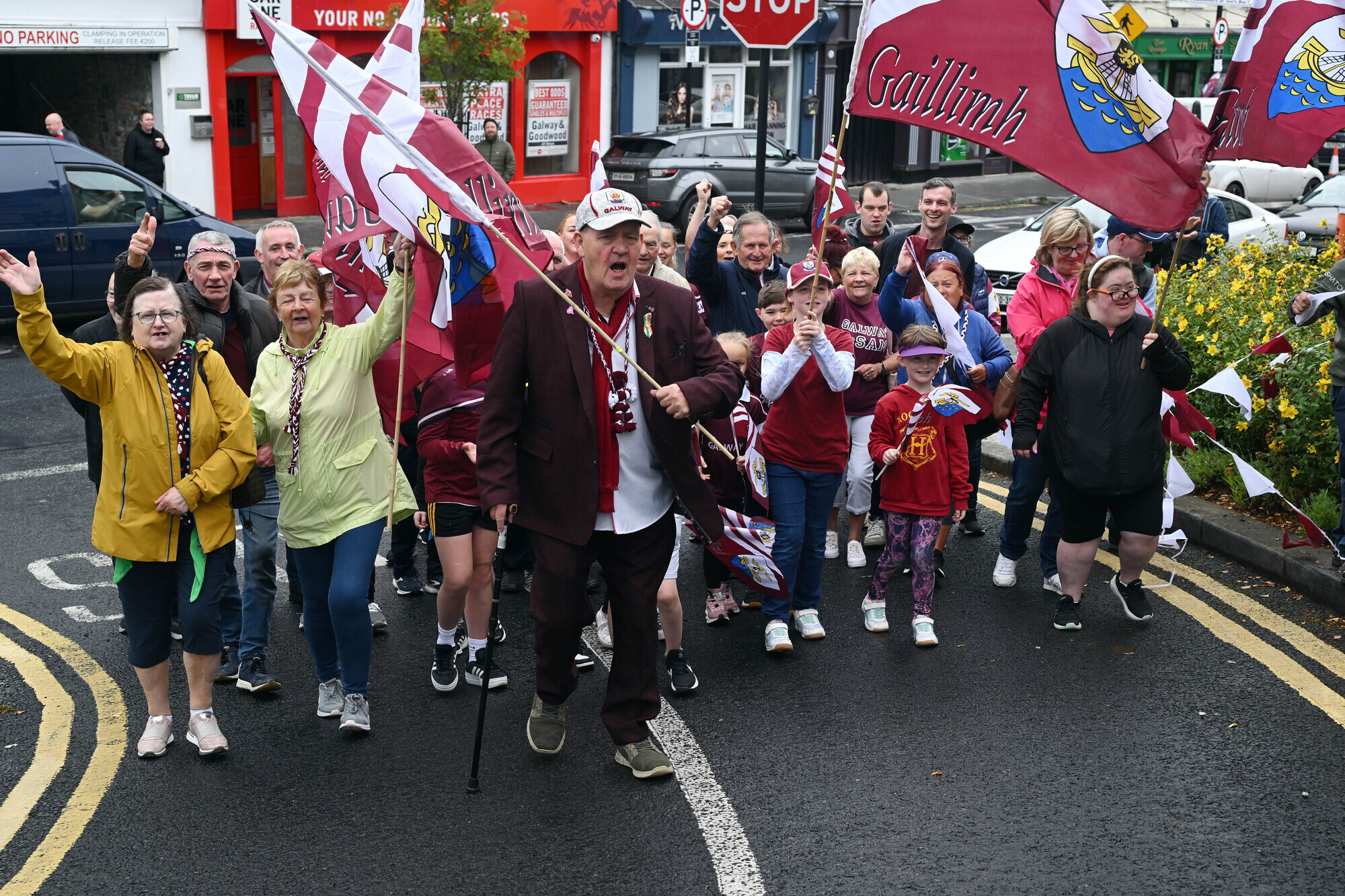 Super fan Joe Kelly leads a group of Galway supporters through the streets of Ballinasloe to support Galway in the All-Ireland football final at Croke Park. Picture: Ray Ryan