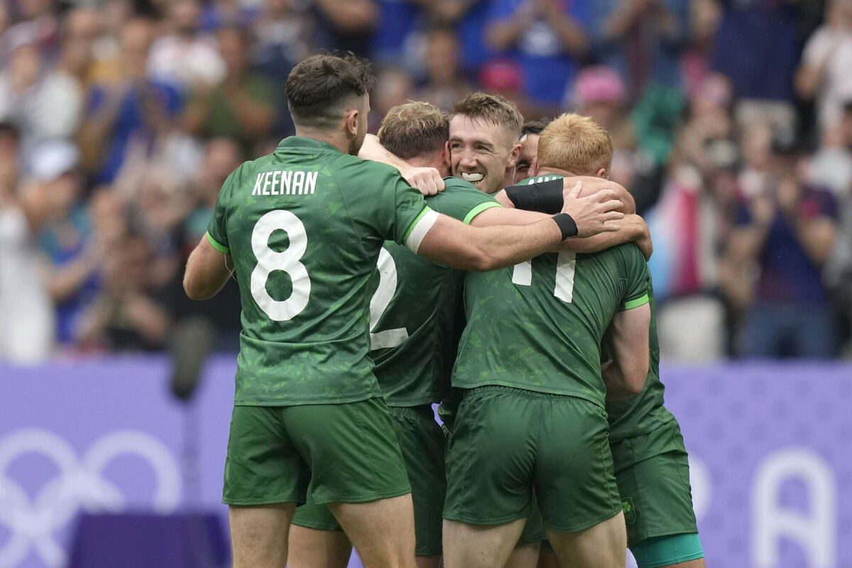 The Irish team celebrates after the end of the during the men's Placing 5-8 Rugby Sevens match. Pic: AP Photo/Vadim Ghirda.