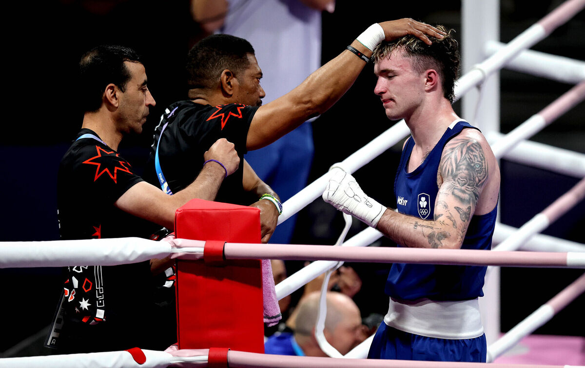 Ireland’s Dean Clancy with Obada Al Kasbeh’s coaches after the fight. Pic: Ryan Byrne, Inpho