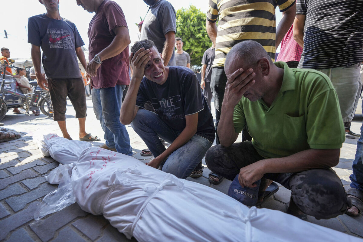 Palestinians mourn a relative, killed in the Israeli bombardment of the Gaza Strip, at a hospital in Deir al-Balah, Saturday, July 27, 2024. (AP Photo/Abdel Kareem Hana)