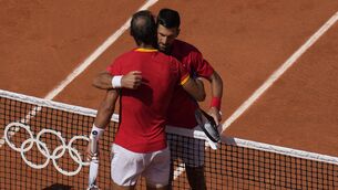 <p>Rafael Nadal, left, hugs Novak Djokovic at the end of their match (Manu Fernandez/AP)</p>