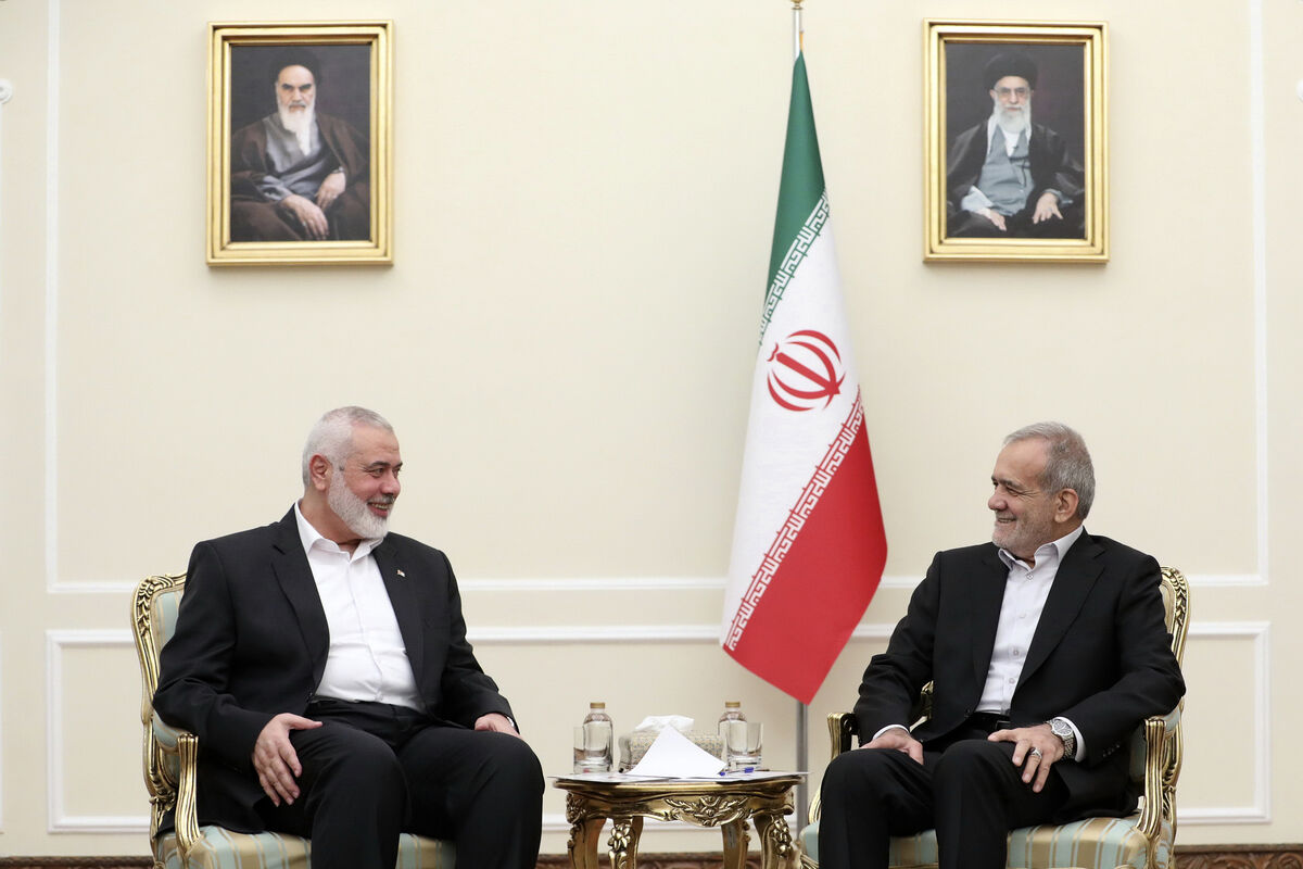 In this photo released by the Iranian Presidency Office, President Masoud Pezeshkian, right, meets Hamas chief Ismail Haniyeh, at the President's office in Tehran, Iran, Tuesday, July 30, 2024. Picture: Iranian Presidency Office via AP