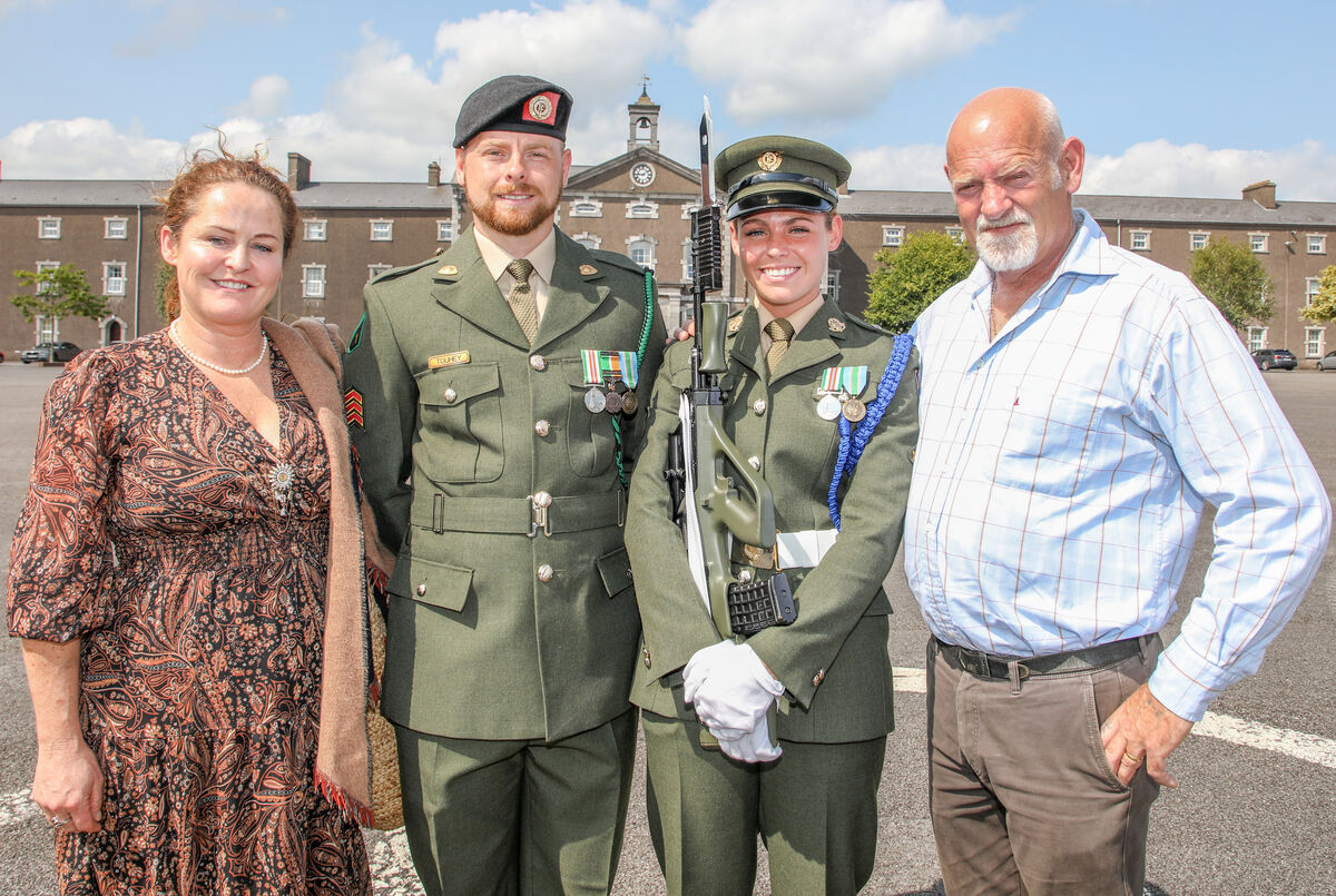 Pte Daisy Byrne with her parents Sandra and Billy Byrne and Sgt Frankie Touhy at the passing-out ceremony. Picture: David Creedon Pte Daisy Byrne with her parents Sandra and Billy Byrne and Sgt Frankie Touhy at the passing-out ceremony. Picture: David Creedon