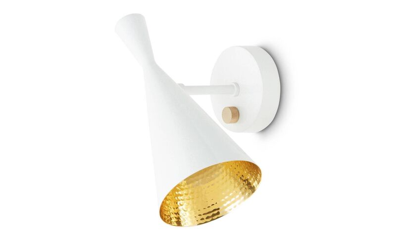 Tom Dixon's Beat wall light in cast iron, spun brass and copper, €439, Ambien Direct. 