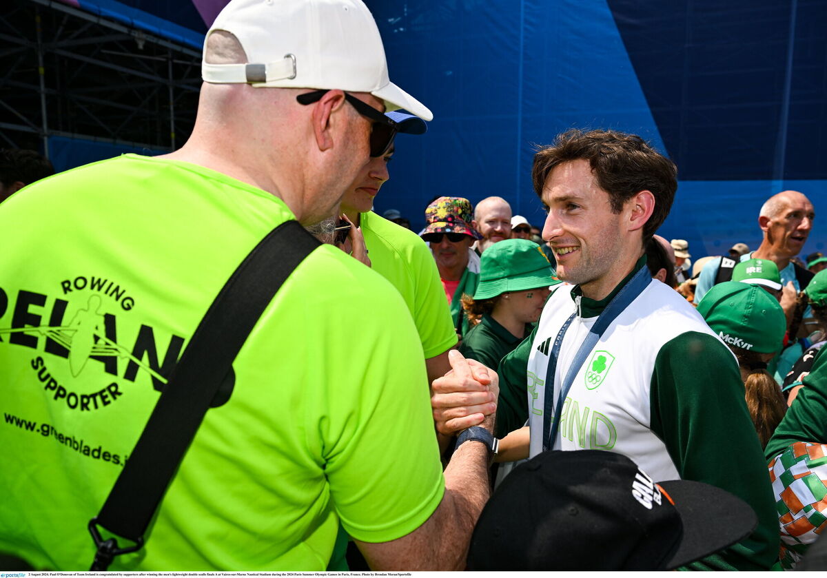 Paul is congratulated by supporters after winning the men's lightweight double sculls finals A