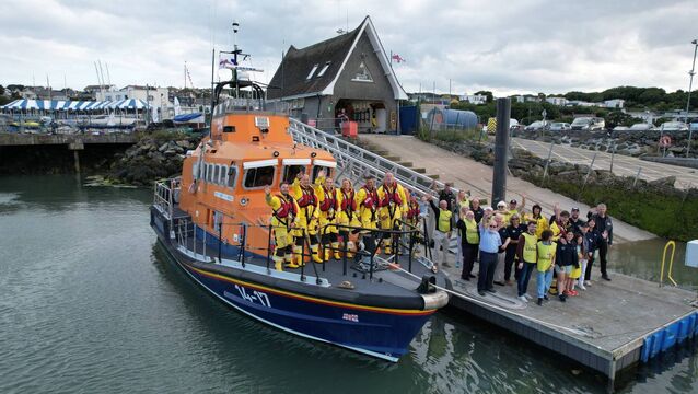 <p>Howth RNLI volunteers gathered to mark 'One Moment for One Crew' to celebrate 200 years of the RNLI. Picture: RNLI/Johnny Wormold</p>