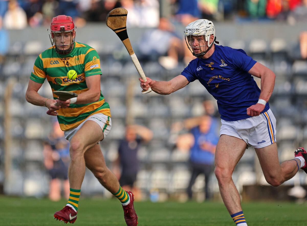  Alan Connolly, Blackrock, is chased by Ciaran Doolan, St. Finbarr's. Picture: Jim Coughlan.