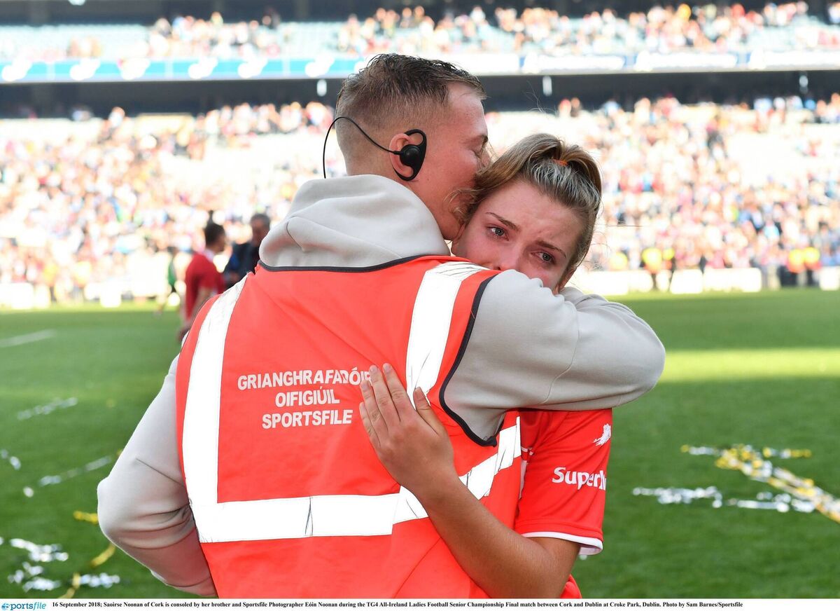 Saoirse Noonan of Cork is consoled by her brother and Sportsfile Photographer Eóin Noonan after the 2018 All-Ireland final. Photo by Sam Barnes/Sportsfile 