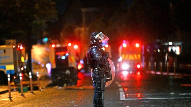 <p>Police in riot gear in the Sandy Row area of Belfast. Picture: Alan Lewis</p>