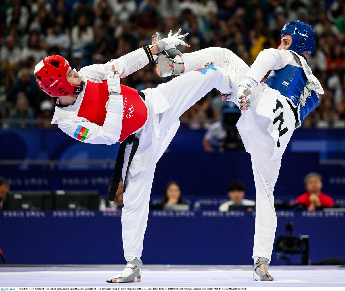 Jack Woolley in action against Gashim Magomedov of Team Azerbaijan during the men's -58kg round of 16 at the Grand Palais. Pic: Stephen McCarthy/Sportsfile