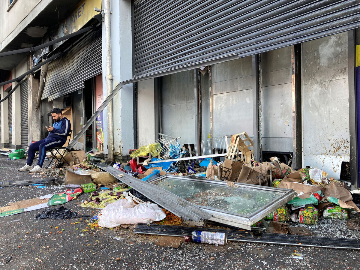 The violent disturbances in Belfast have cost business owners their livelihoods, such as Abdelkader Mohamad Al Alloush (pictured), owner of the Sham Supermarket on Donegall Road in the city. His shop was burned during disorder in the area following an anti-immigration protest on Saturday. Photo: Rebecca Black/PA
