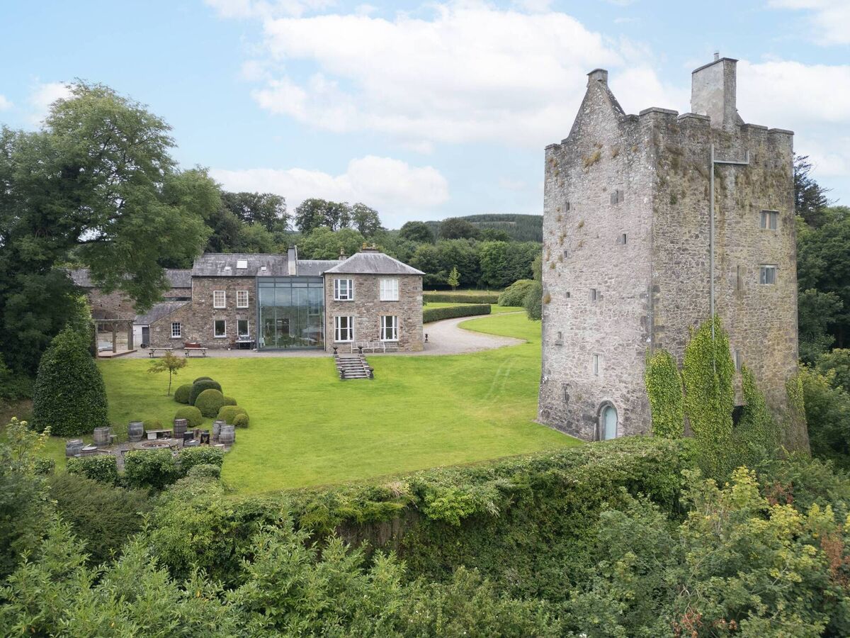 Carrigacunna includes house with glazed atrium, lodge, land, walled garden and 16th century tower house