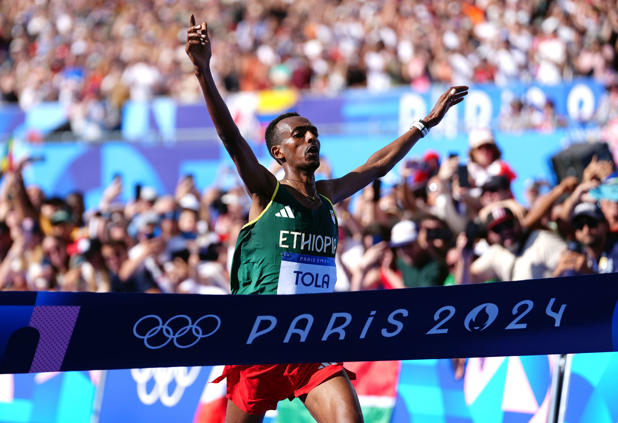 Ethiopia's Tola storms to men's marathon gold as Kipchoge drops out