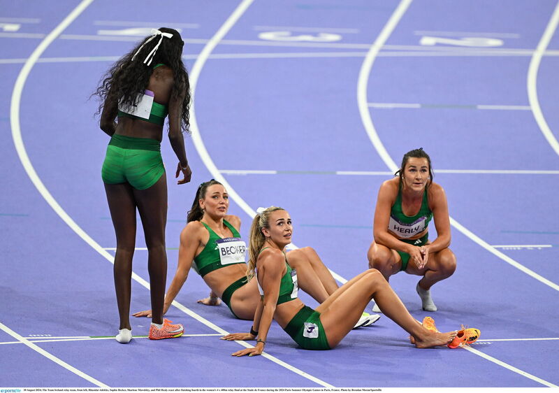 The Team Ireland relay team, from left, Rhasidat Adeleke, Sophie Becker, Sharlene Mawdsley, and Phil Healy react after finishing fourth in the women's 4 x 400m relay final at the Stade de France during the 2024 Paris Summer Olympic Games in Paris, France. Photo by Brendan Moran/Sportsfile