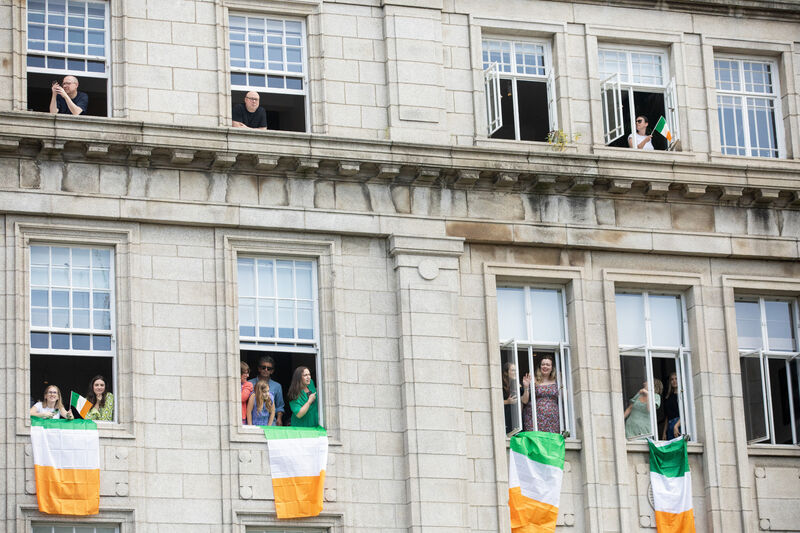 Some lucky attendees managed to get a great vantage point atop buildings and in windows to watch proceedings. Photo: Gareth Chaney Some lucky attendees managed to get a great vantage point atop buildings and in windows to watch proceedings. Photo: Gareth Chaney
