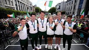 <p>7 UP: Team Ireland's medal winners Rhys McClenaghan, Daire Lynch, Philip Doyle, Mona McSharry, Daniel Wiffen and Fintan McCarthy are welcomed by supporters on O'Connell Street. Paul O'Donovan absent. Photo by Ramsey Cardy/Sportsfile</p>
