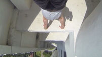 Afraid of heights? This handstand off a skyscraper is for you
