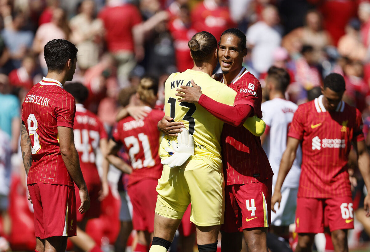 Liverpool's Virgil van Dijk and Sevilla's Orjan Nyland reacts following during the pre-season friendly match at Anfield. Picture: Richard Sellers/PA Wire.
