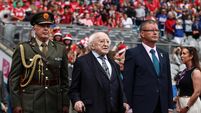 Inpho President of Ireland Michael D. Higgins and Camogie Association President Brian Molloy stand for the President’s salute 11/8/202