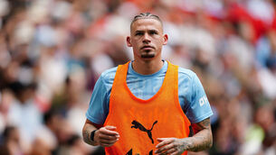 <p>Manchester City's Kalvin Phillips warms up as a substitute during the FA Community Shield match at Wembley Stadium.</p>