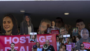 Relatives and supporters of Israeli hostages held by Hamas in Gaza hold photos of their loved ones (Ariel Schalit/AP) Relatives and supporters of Israeli hostages held by Hamas in Gaza hold photos of their loved ones (Ariel Schalit/AP)