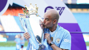<p>SAME AGAIN? Pep Guardiola with the Premier League trophy. Pic: Martin Rickett/PA Wire.</p>
