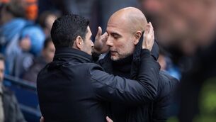<p>A KISS Goodbye: Manchester City manager Pep Guardiola and Arsenal manager Mikel Arteta. Pic: PA WIRE</p>