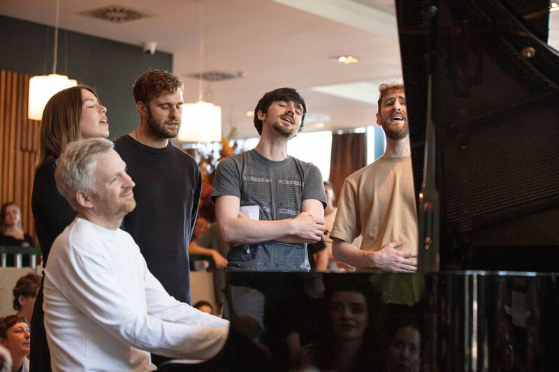 Eoin French with Olafur Arnolds on piano, singing with Niamh Regan and Ye Vagabonds' Brían and Diarmaid Mac Gloinn at the River Lee Hotel during Sounds from a Safe Harbour 2023. Picture: Bríd O'Donovan