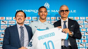 <p>Marseille's Spanish President Pablo Longoria (L), OM councellor Fabrizio Ravanelli (R) and Olympique de Marseille (OM) football club's newly recruited English forward Mason Greenwood (C) pose with the official jersey. Pic: CLEMENT MAHOUDEAU/AFP via Getty Images.</p>