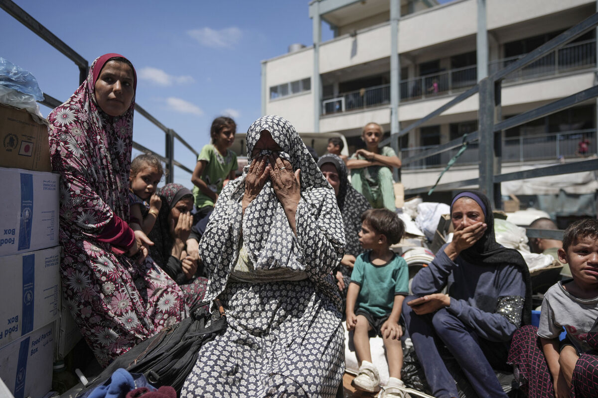 Palestinian women weep on a truck as she evacuates a school that had been her shelter, in eastern Deir al-Balah, Gaza Strip on Friday. Picture: AP Photo/Abdel Kareem Hana Palestinian women weep on a truck as she evacuates a school that had been her shelter, in eastern Deir al-Balah, Gaza Strip on Friday. Picture: AP Photo/Abdel Kareem Hana