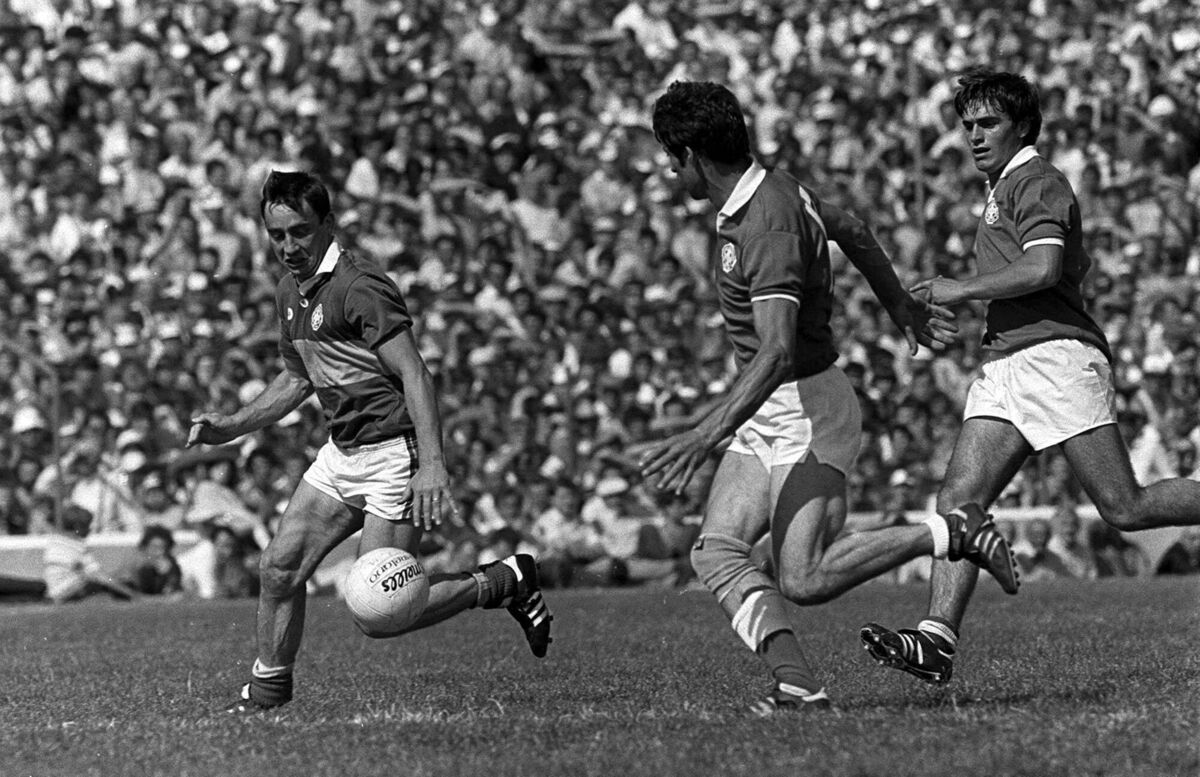 Denis 'Ogie' Moran of Kerry in action against Kevin Kehily and Tony Nation, right, of Cork during the Munster Final in 1984