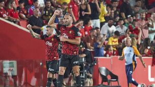 <p>GOOD DRAW: Vedat Muriqi of RCD Mallorca celebrates scoring his teamÂŽs first goal with teammates during the La Liga match. Picture: Rafa Babot/Getty Images</p>