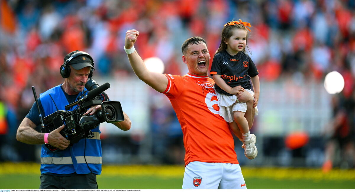 SPECIAL MOMENT: Aaron McKay of Armagh and his daughter Nova after the All-Ireland final. Photo by Ray McManus/Sportsfile