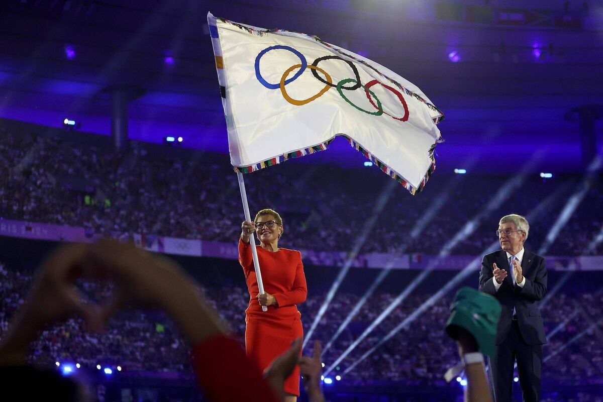 Flag-waving? LA mayor Karen Bass waves the Olympic flag as Thomas Bach, President of IOC applauds during the closing ceremony in Paris. Pic: Carl Recine/Getty Images)