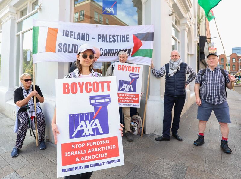  09/08/2024 Dublin Ireland. Human rights campaigners at an action outside AXA, Mountjoy Square, on August 9 2024, to pressure them to stop investing in Israeli bank, Bank Hapoalim. Photograph: Leah Farrell / © RollingNews.ie