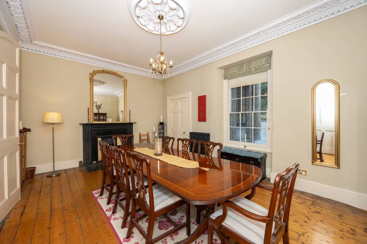 Dining room links to a service kitchen, one of two in the four/five storey home