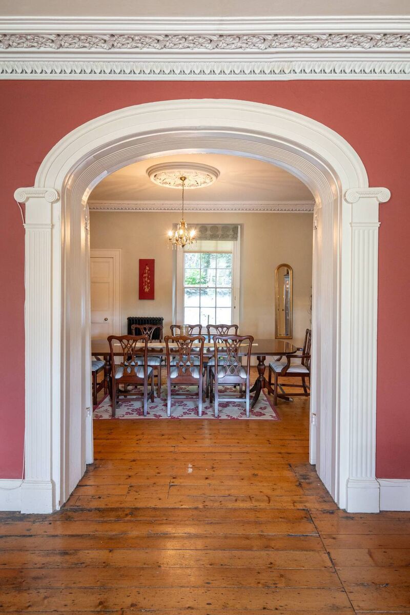 Graceful arch links entry level's two reception rooms