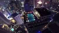 VIDEO: Base jumpers jump off skyscraper, land in pool party