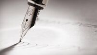 Fountain pen writing a signature