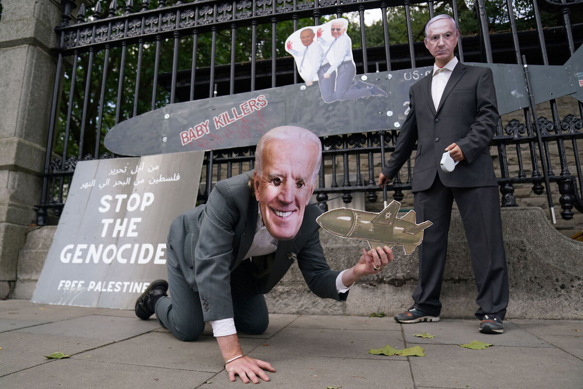 Protesters wearing a Joe Biden mask and Benjamin Netanyahu mask at a pro-Palestine protest outside Leinster House. Picture: Brian Lawless/PA Wire Protesters wearing a Joe Biden mask and Benjamin Netanyahu mask at a pro-Palestine protest outside Leinster House. Picture: Brian Lawless/PA Wire