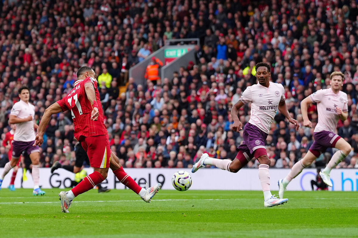 Liverpool's Mohamed Salah scores their side's second goal of the game during the Premier League match at Anfield. Pic: Peter Byrne/PA Wire.