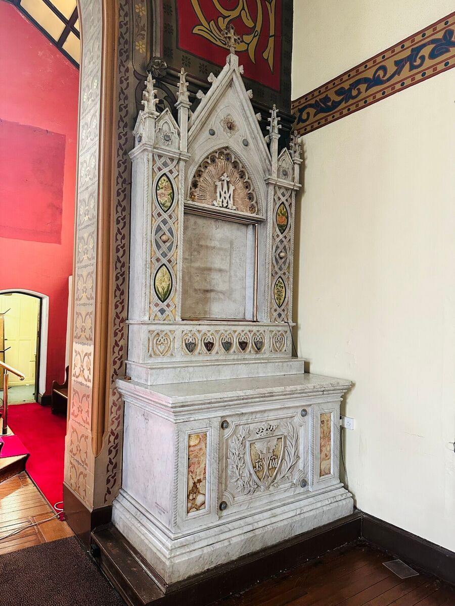 A sculpted altar by J F Davis with the Redemptorist coat of arms made €1,900.