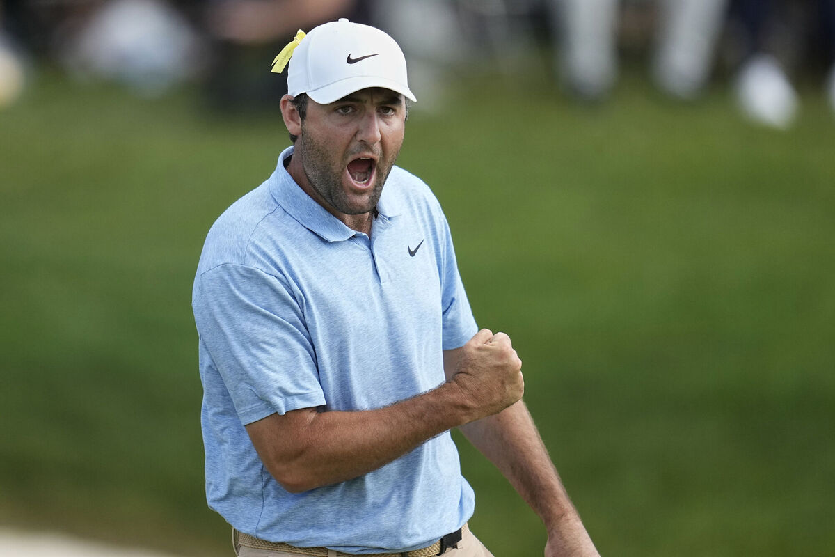 Scottie Scheffler pumps his fist after sinking a putt on the 18th green to win the Memorial golf tournament Scottie Scheffler pumps his fist after sinking a putt on the 18th green to win the Memorial golf tournament