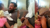 This little girl is NOT impressed by her dad shaving off his beard