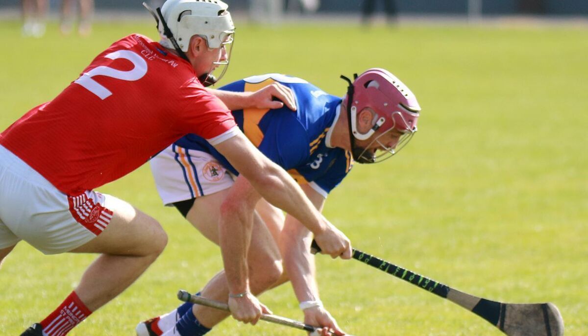 Diarmuid Bynres, Patrickswll, under pressure from Billy Molyneaux, Mungret St Paul's in the Limerick Senior Hurling Championship, Group 1 R3