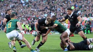 <p>South Africa's full-back Aphelele Fassi (CR) tackles New Zealand's loose forward Sam Cane (C) during the Rugby Championship Test match between South Africa and New Zealand at the Ellis Park Stadium in Johannesburg. (Photo by PHILL MAGAKOE/AFP via Getty Images)</p>