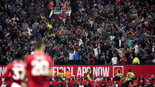 <p>Liverpool fans celebrate in the stands following the opening goal of the game. Pic: Nick Potts/PA Wire.</p>